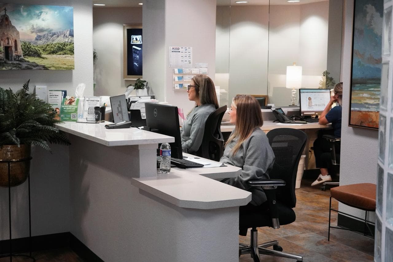 Smile Suite front office team working at the reception desk