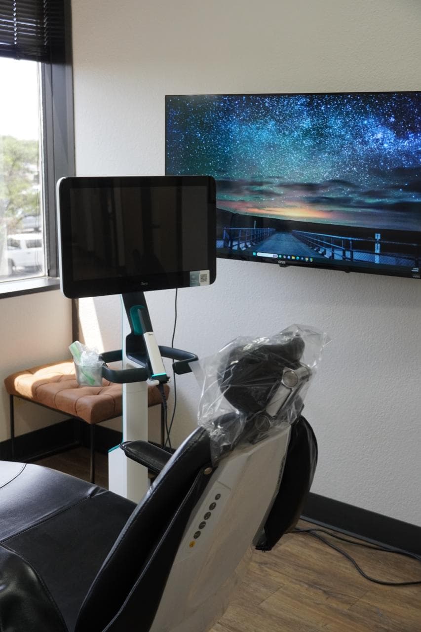 Modern treatment room with digital scanner and monitor at The Smile Suite