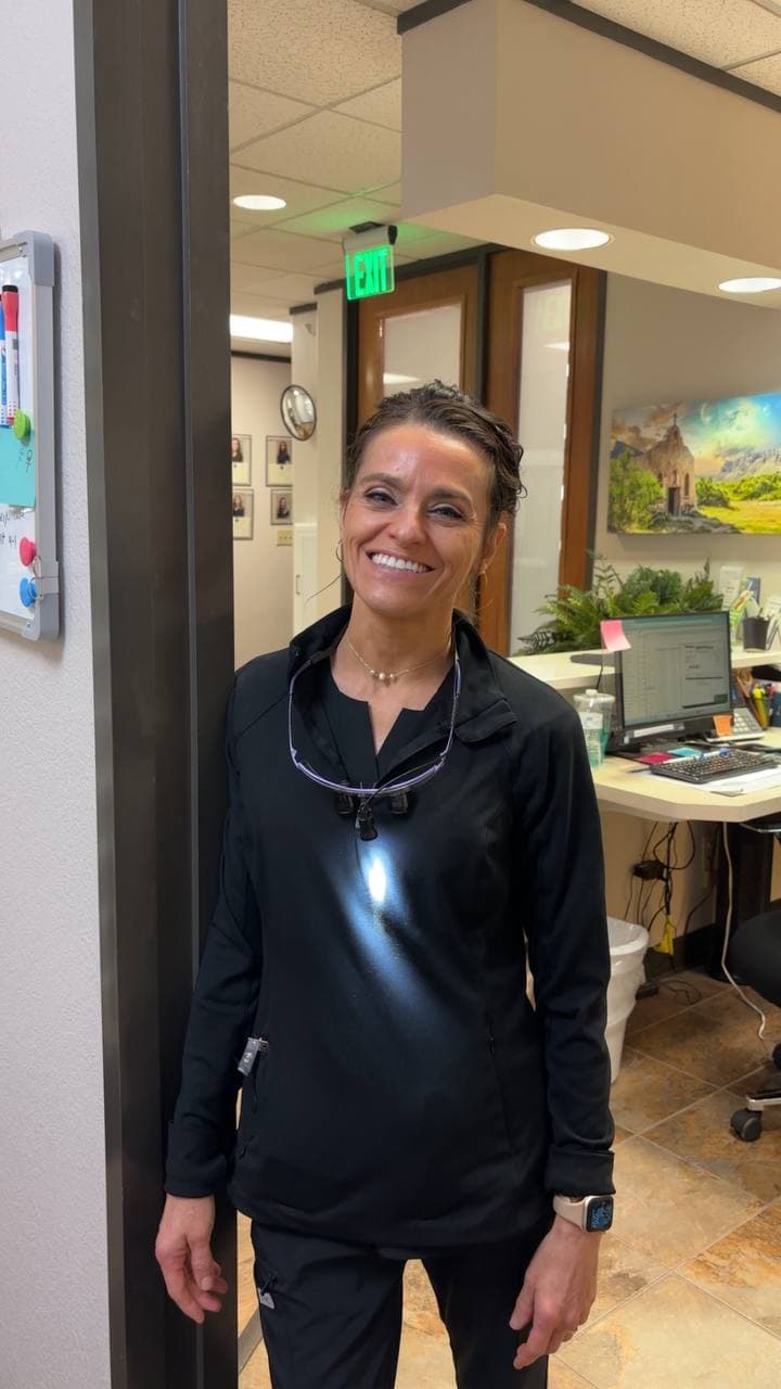 A smiling Smile Suite team member in the Midland office