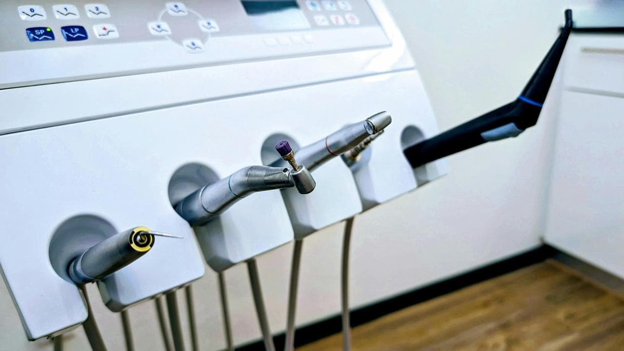 Modern dental handpieces and technology equipment at The Smile Suite